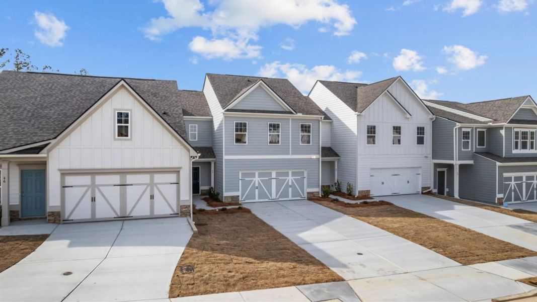 Front exterior of a new home in The Retreat at Browns Ridge, Newnan, GA, highlighting curb appeal (Image 4). Front exterior of a new home in The Retreat at Browns Ridge, Newnan, GA, highlighting curb appeal (Image 4).