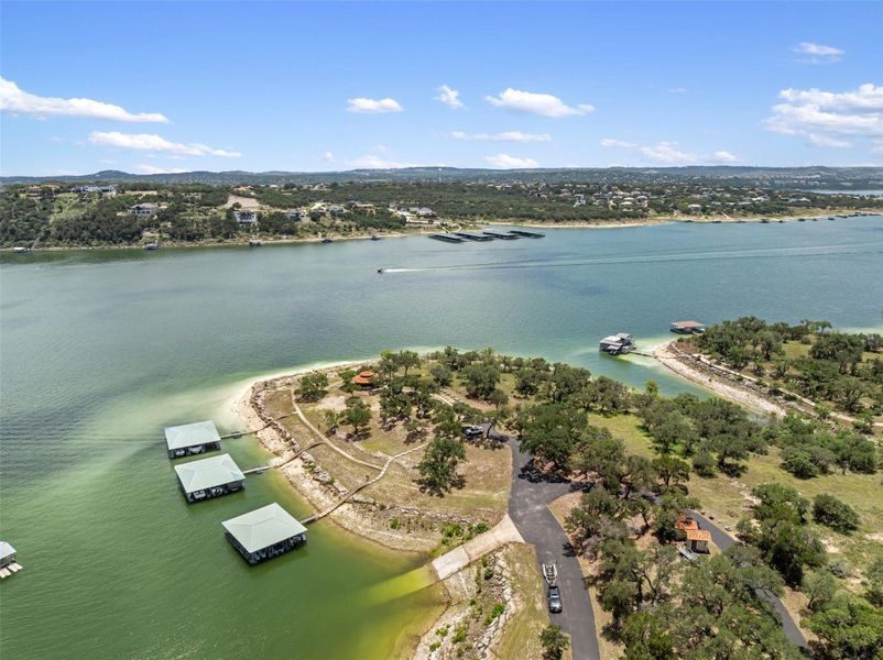 Discover expansive waterfront views with multiple private boat slips and serene natural surroundings. Discover expansive waterfront views with multiple private boat slips and serene natural surroundings.