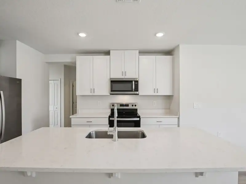 Furnished interior view inside a new home in The Grove at Stuart Crossing - Premier Series, Bartow (Image 3).
