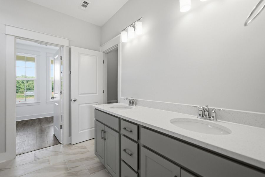 Furnished interior view inside a new home in Aden Woods, Fairview (Image 12).