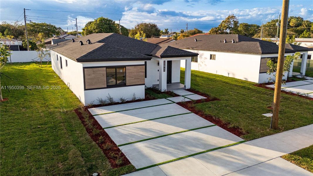 Front exterior of a new home in , Miami, FL, highlighting curb appeal (Image 28). Front exterior of a new home in , Miami, FL, highlighting curb appeal (Image 28).