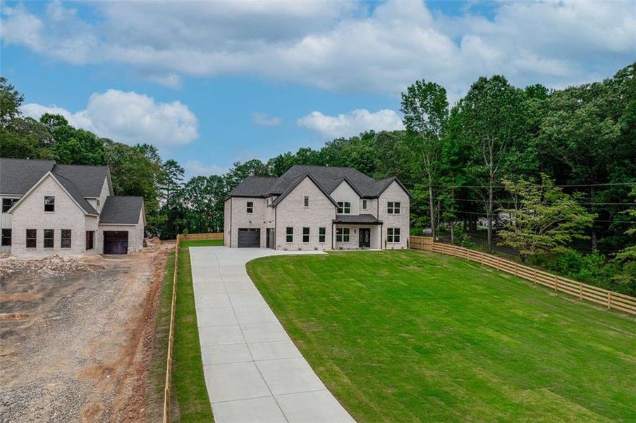Front exterior of a new home in , Dacula, GA, highlighting curb appeal (Image 25).