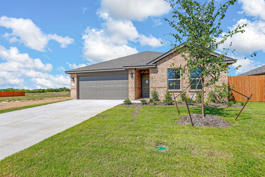 Representative exterior photo of a completed home built from the Essex by Cheldan Homes in Stoneview, Glen Rose, TX (Image 32).