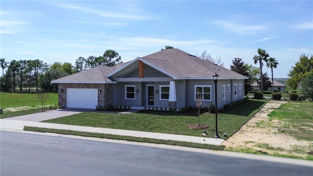 Front exterior of a new home in , Lake Alfred, FL, highlighting curb appeal (Image 24).