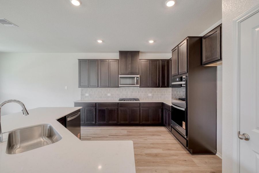 Furnished interior view inside a new home in River Bluff, Leander (Image 15). Furnished interior view inside a new home in River Bluff, Leander (Image 15).
