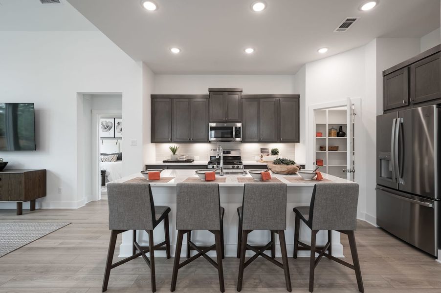 Representative furnished interior of a home built from the Wren by Tri Pointe Homes in Oakhill Reserve, Tomball (Image 10).