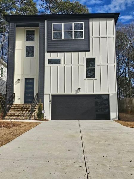 Front exterior of a new home in , Scottdale, GA, highlighting curb appeal (Image 1). Front exterior of a new home in , Scottdale, GA, highlighting curb appeal (Image 1).