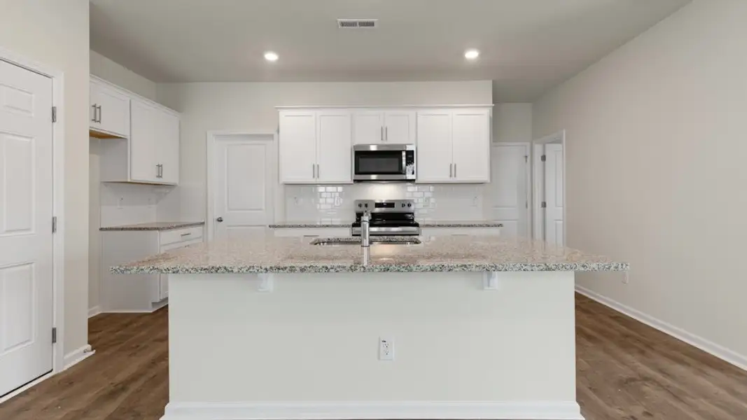 Furnished interior view inside a new home in The Grove at Matthews Landing, Fuquay Varina (Image 3).