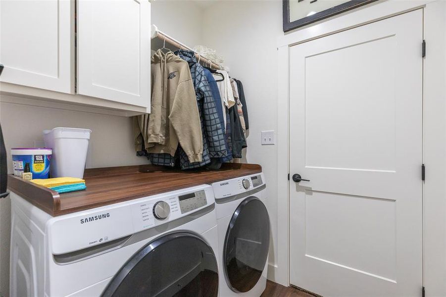 Laundry room leading into the primary closet.