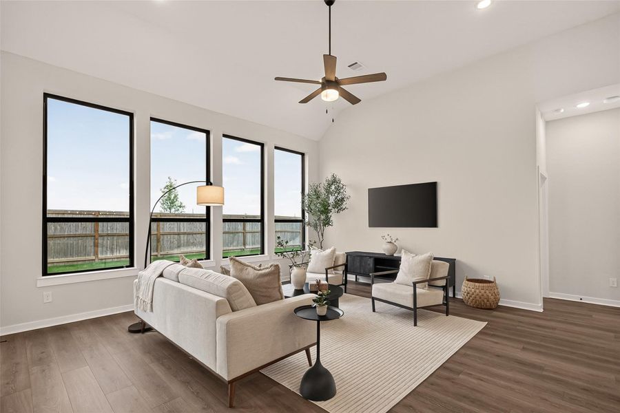 Generously sized family room bathed in natural light.