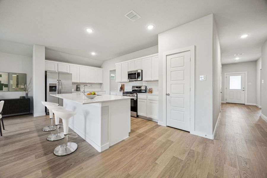 Kitchen in the Harrison home plan by Trophy Signature Homes – REPRESENTATIVE PHOTO