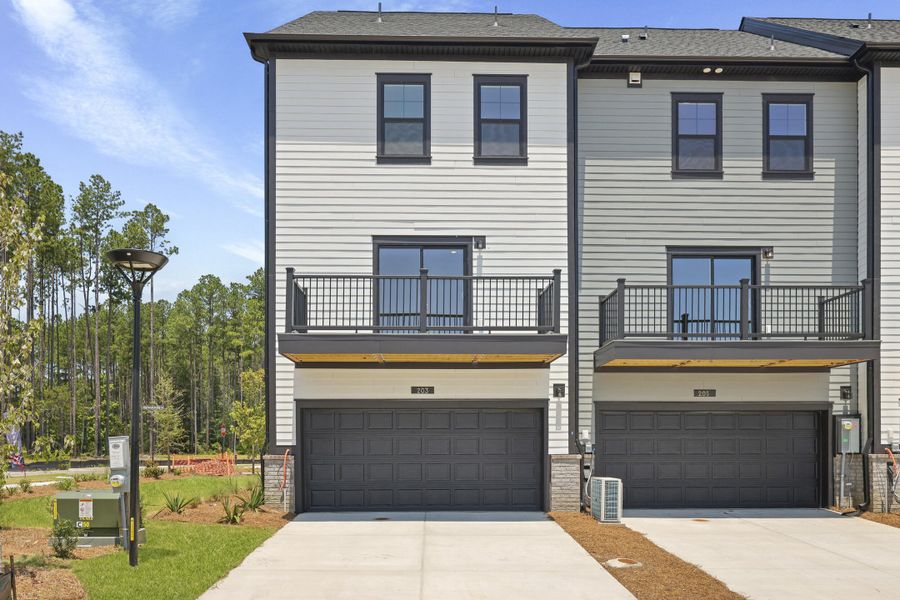 Front exterior of a new home in Nexton, Summerville, SC, highlighting curb appeal (Image 29). Front exterior of a new home in Nexton, Summerville, SC, highlighting curb appeal (Image 29).
