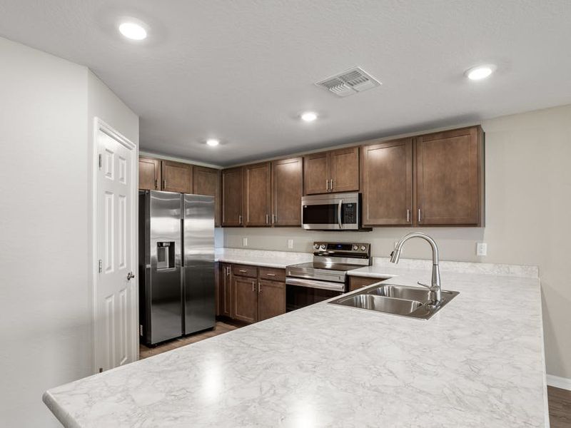 Brand-new, 3 bedroom, open-layout townhome for sale in Winter Haven, FL with a den!