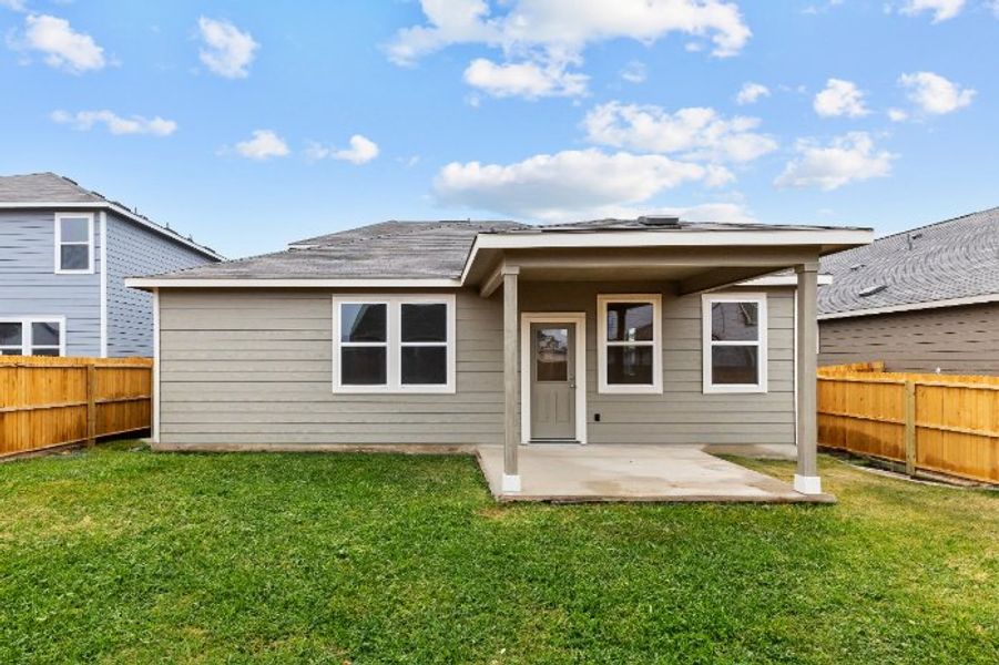 A small house with a fence.