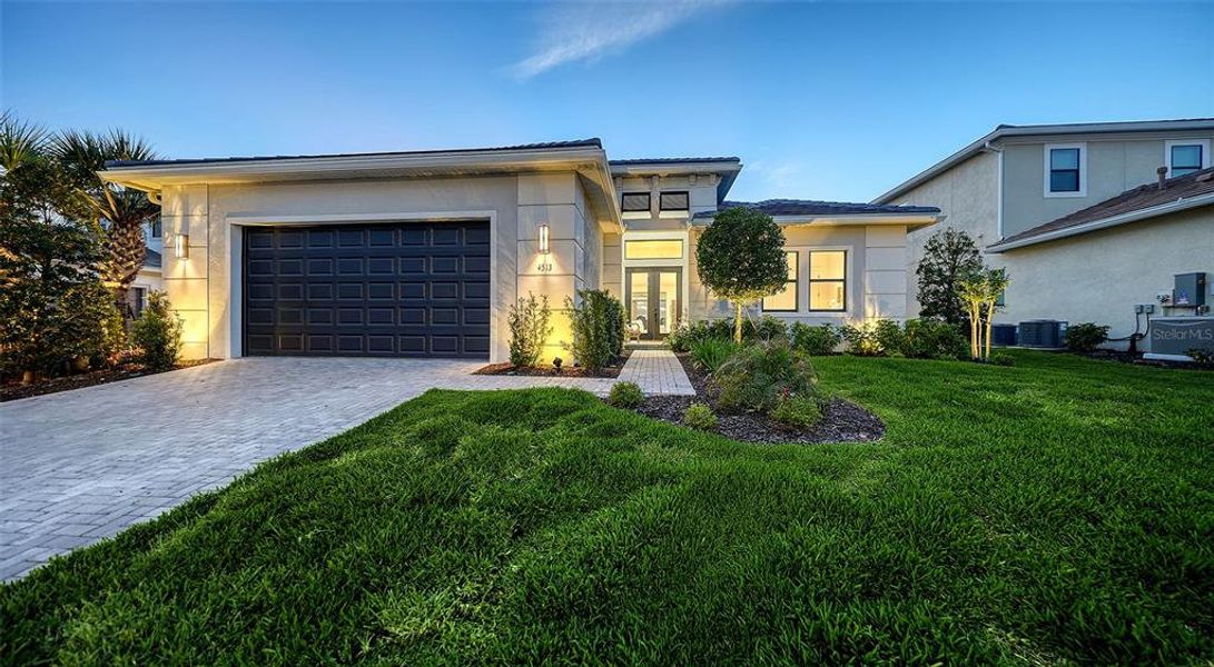 Front exterior of a new home in , Sarasota, FL, highlighting curb appeal (Image 25).