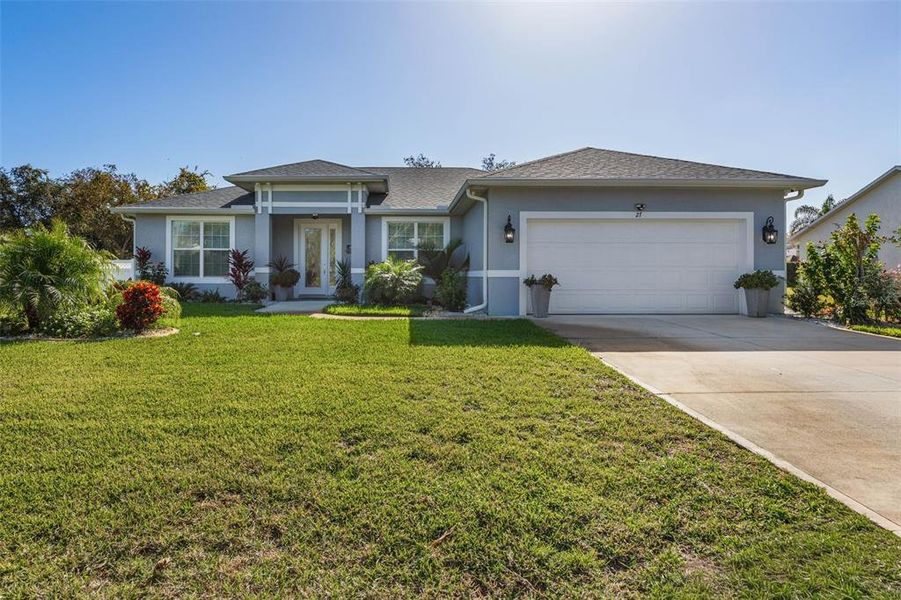 Front exterior of a new home in , Palm Coast, FL, highlighting curb appeal (Image 21).