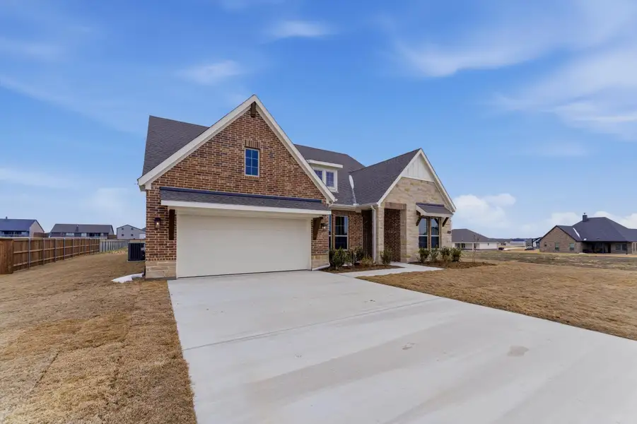 Front exterior of a new home in Fairview Meadows, New Fairview, TX, highlighting curb appeal (Image 15).