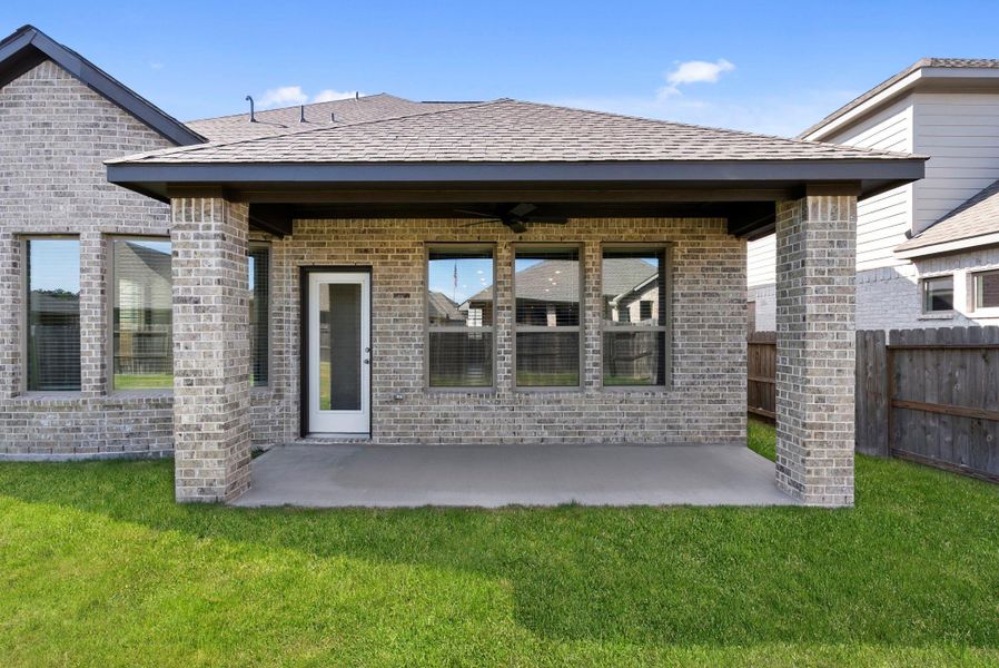 Exterior details and patio area of a home in The Trails 50', New Caney (Image 4).