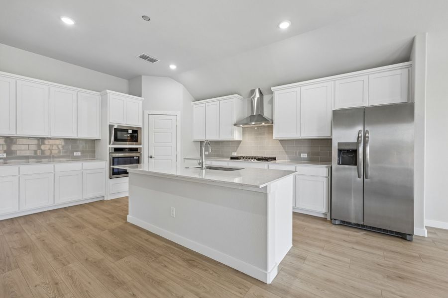 Kitchen in the Gilmour II home plan by Trophy Signature Homes