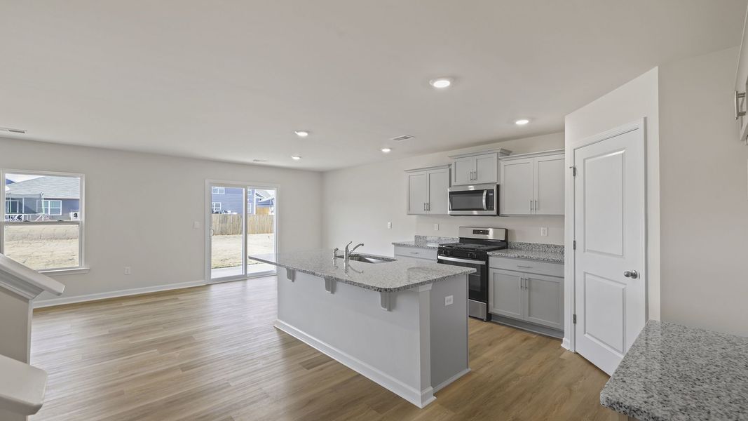 Furnished interior view inside a new home in Bentley Park, Greenwood (Image 6).