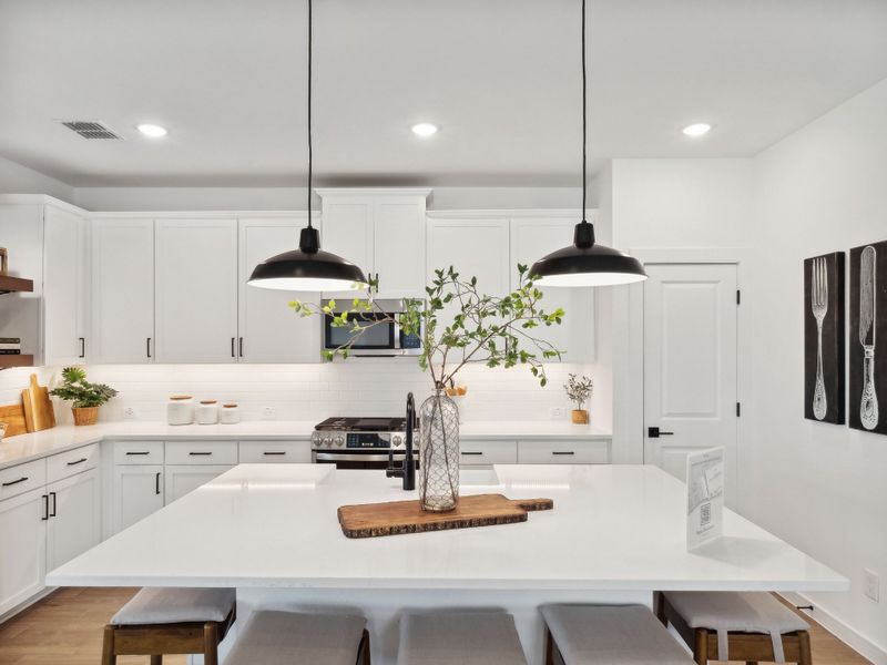 Kitchen with pendant lighting and floating shelves Kitchen with pendant lighting and floating shelves