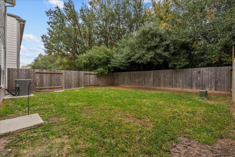 View of backyard that is larger than most in the subdivision.
