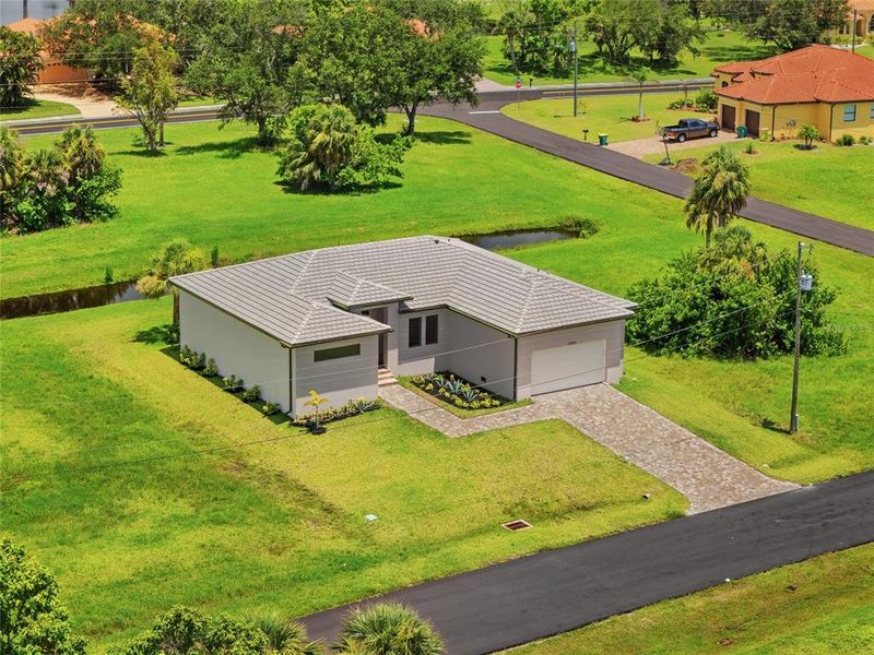 Front exterior of a new home in , Punta Gorda, FL, highlighting curb appeal (Image 29).