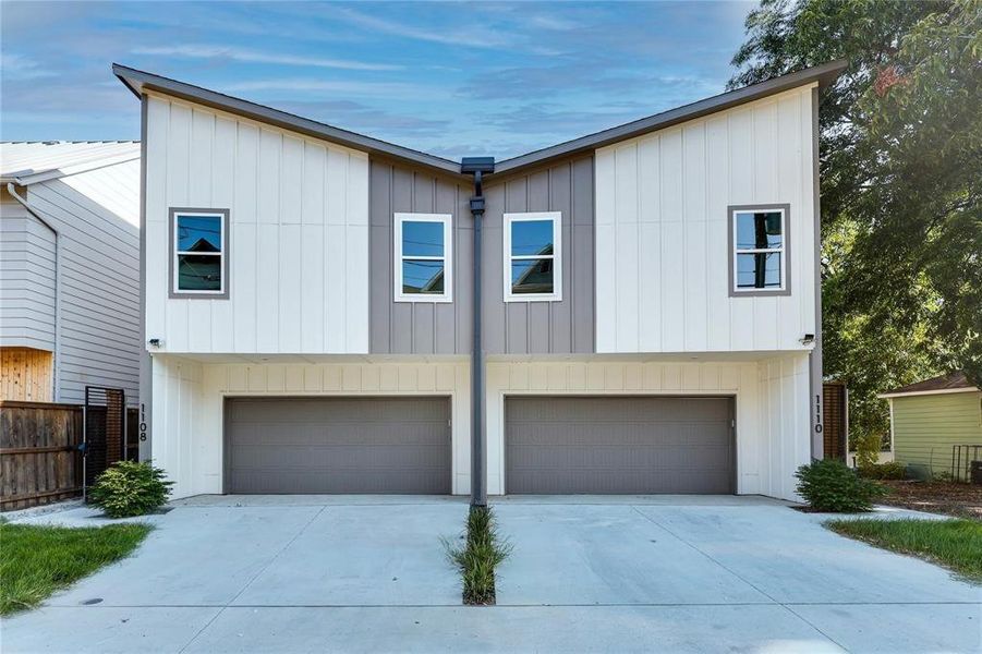 View of front of property featuring a garage