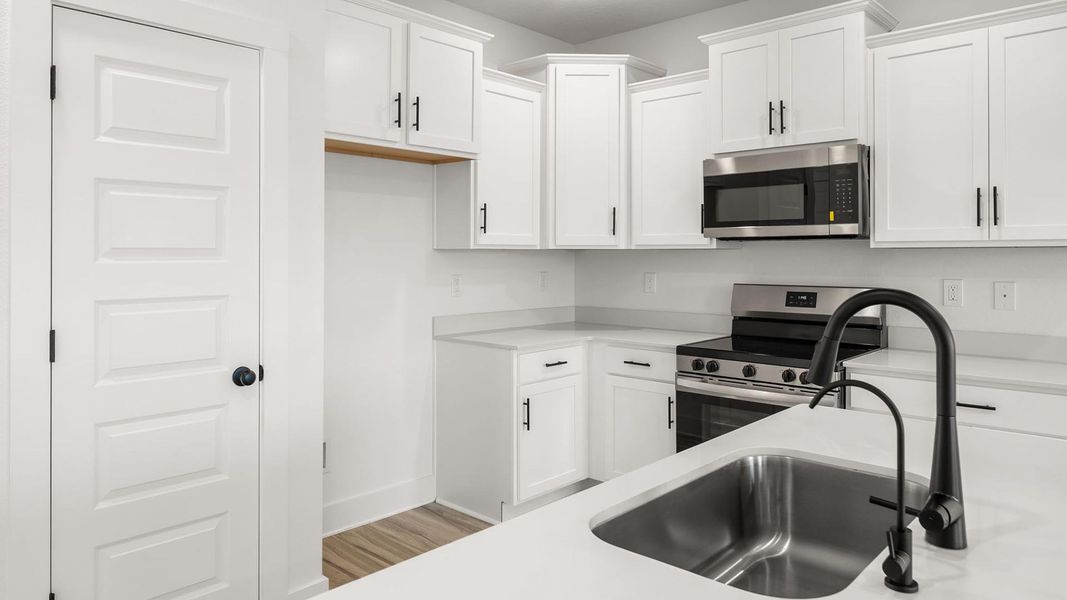Furnished interior view inside a new home in Colonial East Townhomes, Panama City Beach (Image 6).