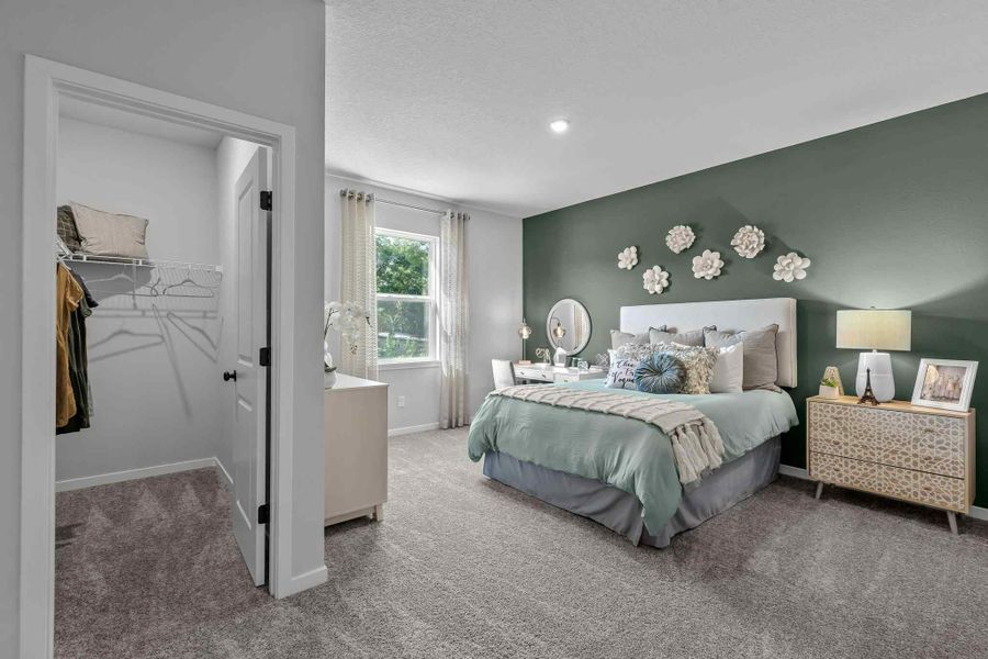A bedroom with a large bed.