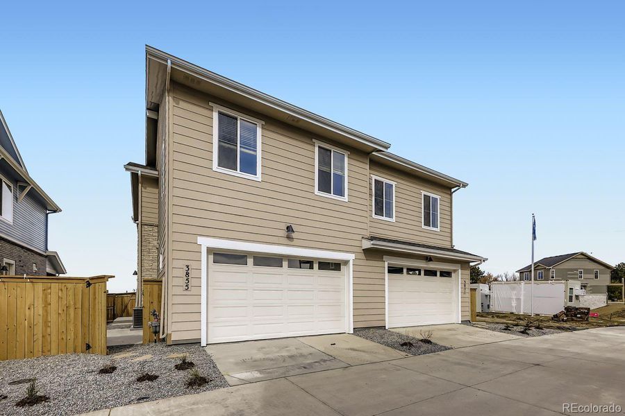 Front exterior of a new home in Uplands, Westminster, CO, highlighting curb appeal (Image 1).