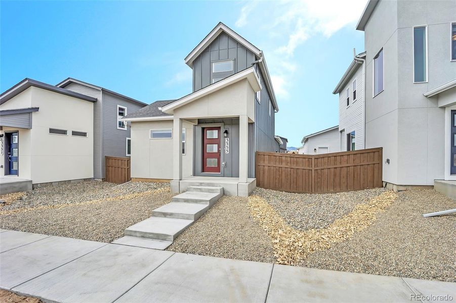 Front exterior of a new home in , Colorado Springs, CO, highlighting curb appeal (Image 27). Front exterior of a new home in , Colorado Springs, CO, highlighting curb appeal (Image 27).