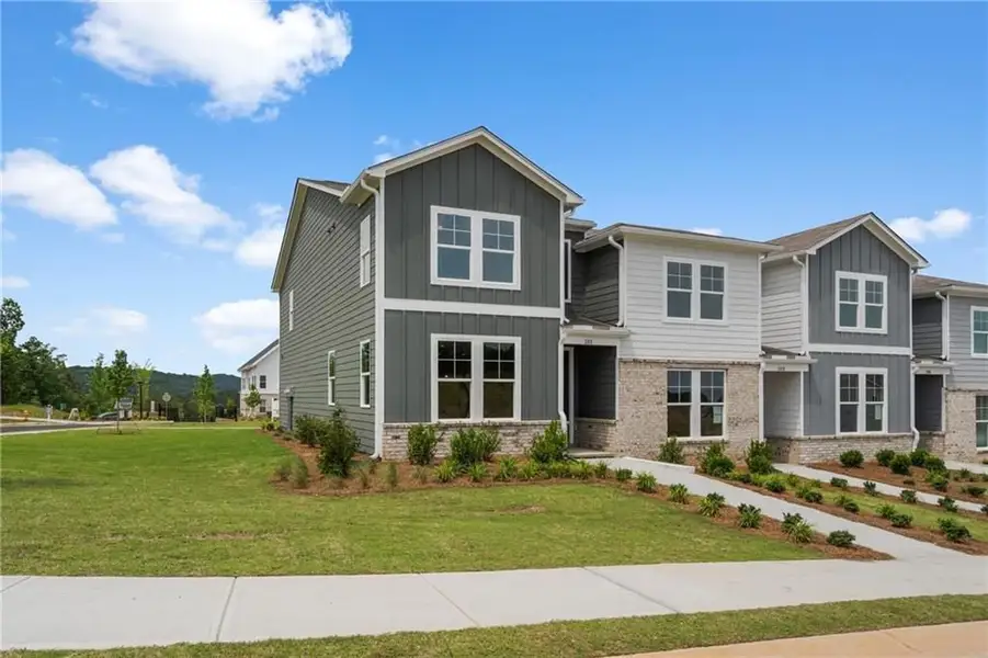 Front exterior of a new home in Stegall Village, Emerson, GA, highlighting curb appeal (Image 2). Front exterior of a new home in Stegall Village, Emerson, GA, highlighting curb appeal (Image 2).