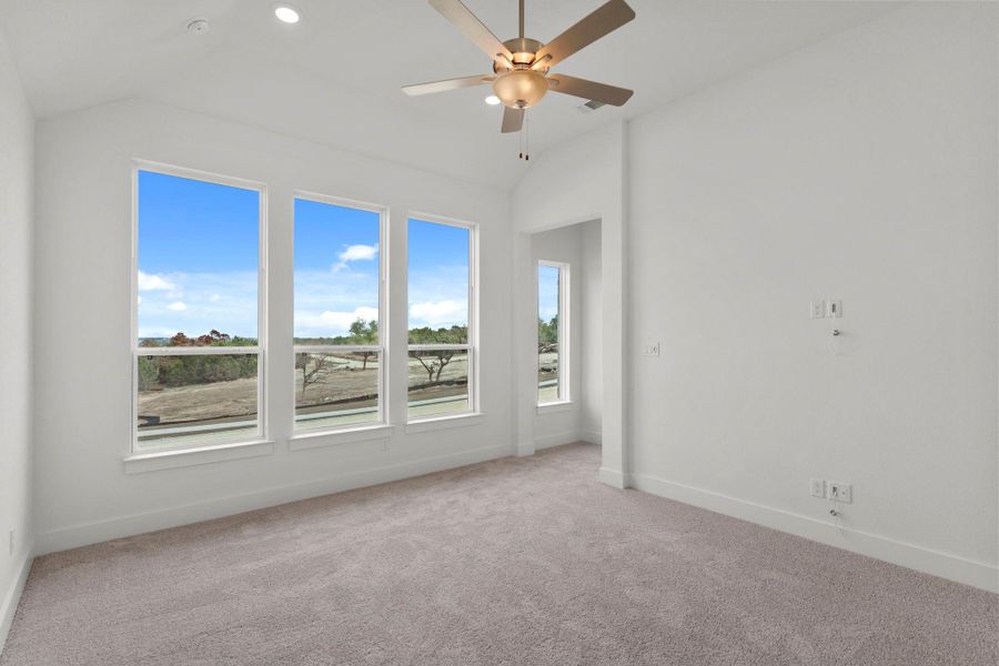 Primary Bedroom with elevated ceiling Primary Bedroom with elevated ceiling