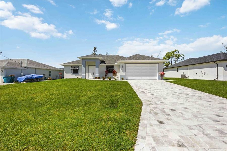 Front exterior of a new home in , Port Charlotte, FL, highlighting curb appeal (Image 25).