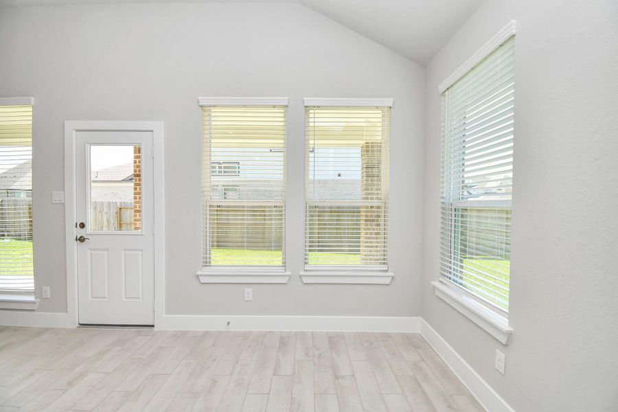 Enjoy breakfast with ease in the connected and cozy breakfast area, seamlessly integrated with the kitchen for utmost convenience. Step through the back door for a breath of fresh air onto the covered patio, extending your living space to the outdoors Enjoy breakfast with ease in the connected and cozy breakfast area, seamlessly integrated with the kitchen for utmost convenience. Step through the back door for a breath of fresh air onto the covered patio, extending your living space to the outdoors