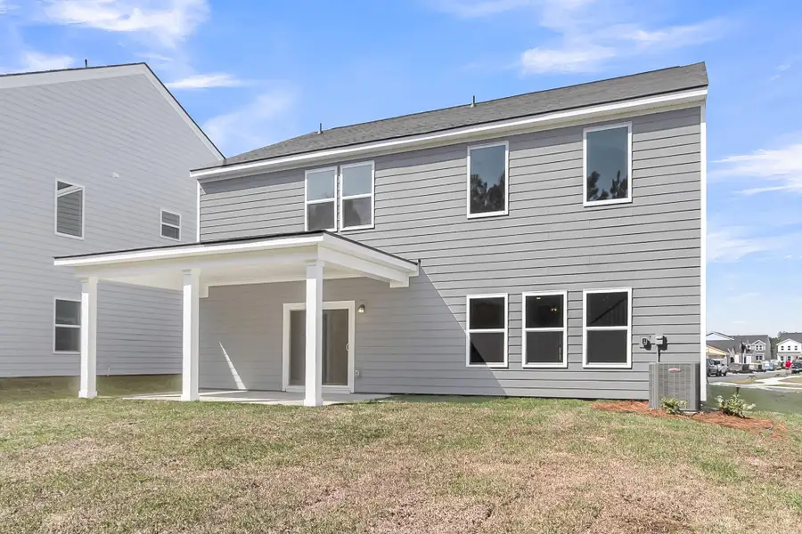 Exterior details and patio area of a home in , Ravenel (Image 21).