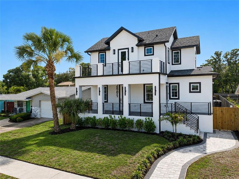 Front exterior of a new home in , St. Petersburg, FL, highlighting curb appeal (Image 25).