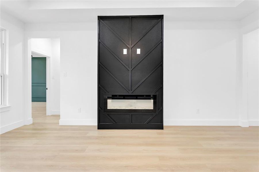 Detailed view of wood finished floors and baseboards