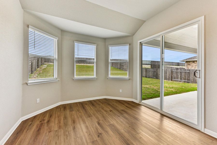 Oversized breakfast room with large glass sliders leading to amazing back patio