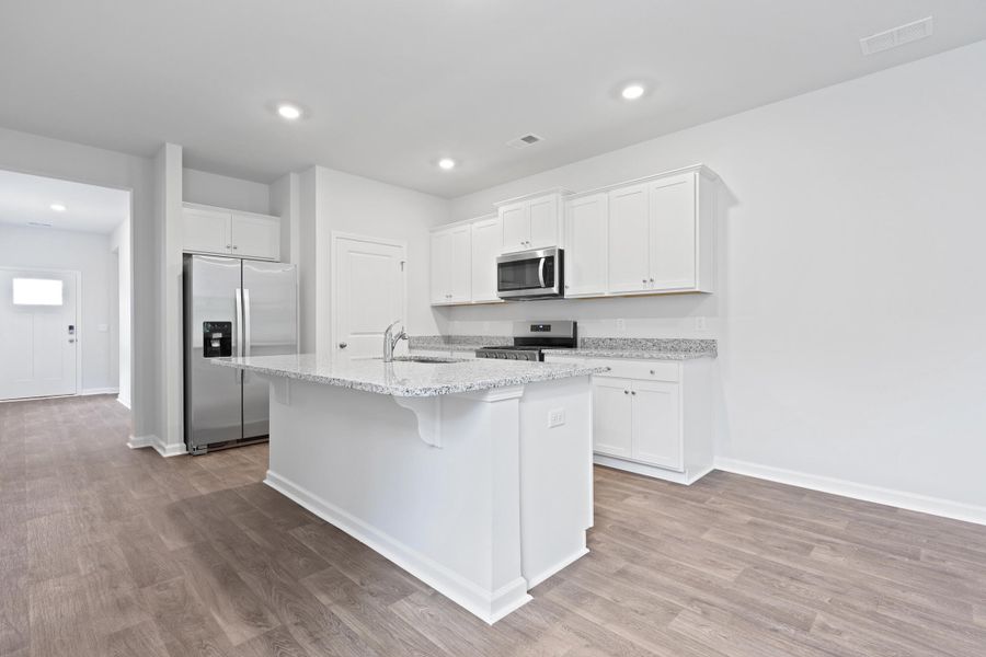 Furnished interior view inside a new home in Pine Hills at Cane Bay, Summerville (Image 7).