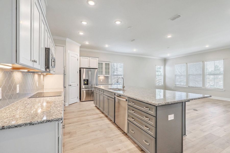 Furnished interior view inside a new home in K. Hovnanian's® Four Seasons at Lakes of Cane Bay, Summerville (Image 7).