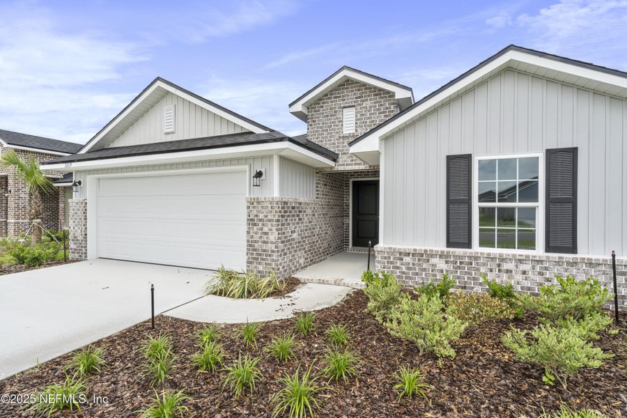 Front exterior of a new home in Shadow Crest at Rolling Hills, Green Cove Springs, FL, highlighting curb appeal (Image 16). Front exterior of a new home in Shadow Crest at Rolling Hills, Green Cove Springs, FL, highlighting curb appeal (Image 16).