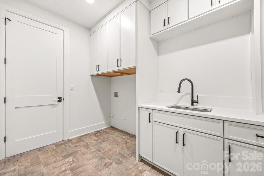 Laundry room, attached to call and primary bedroom Laundry room, attached to call and primary bedroom