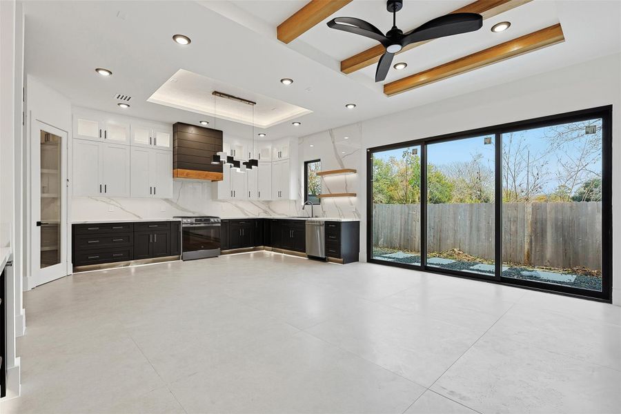 High ceilings and white walls throughout the home provide a clean, neutral interior.