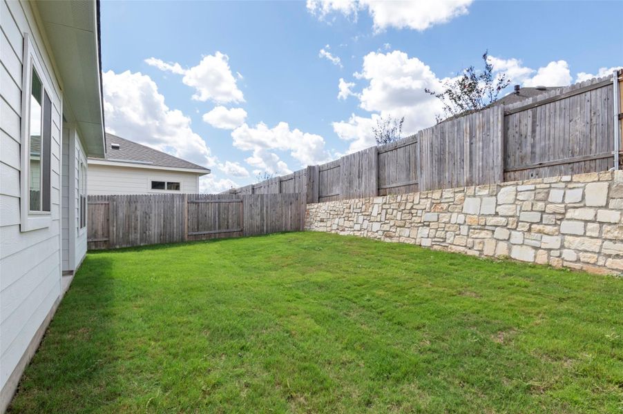 Exterior details and patio area of a home in Crosswinds, Kyle (Image 3).