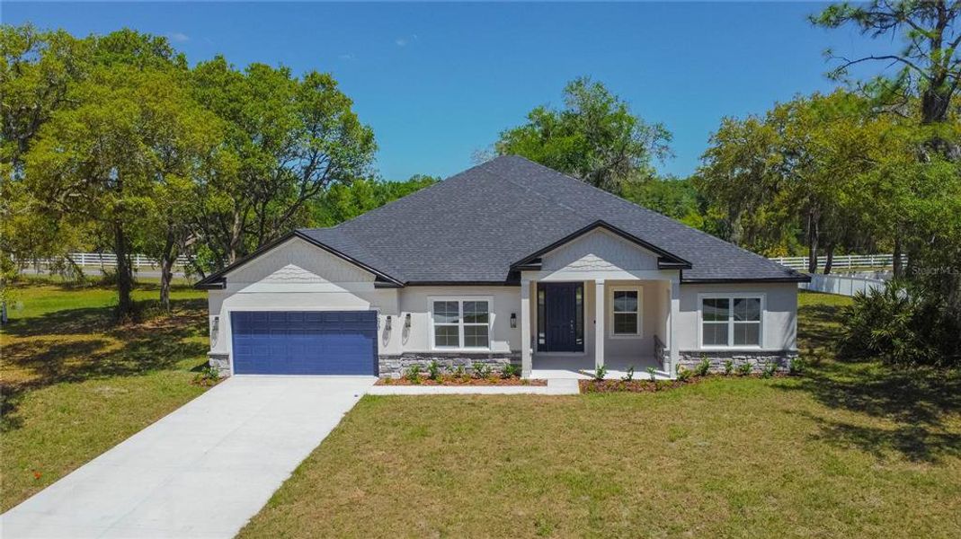 Front exterior of a new home in , Inverness, FL, highlighting curb appeal (Image 24).