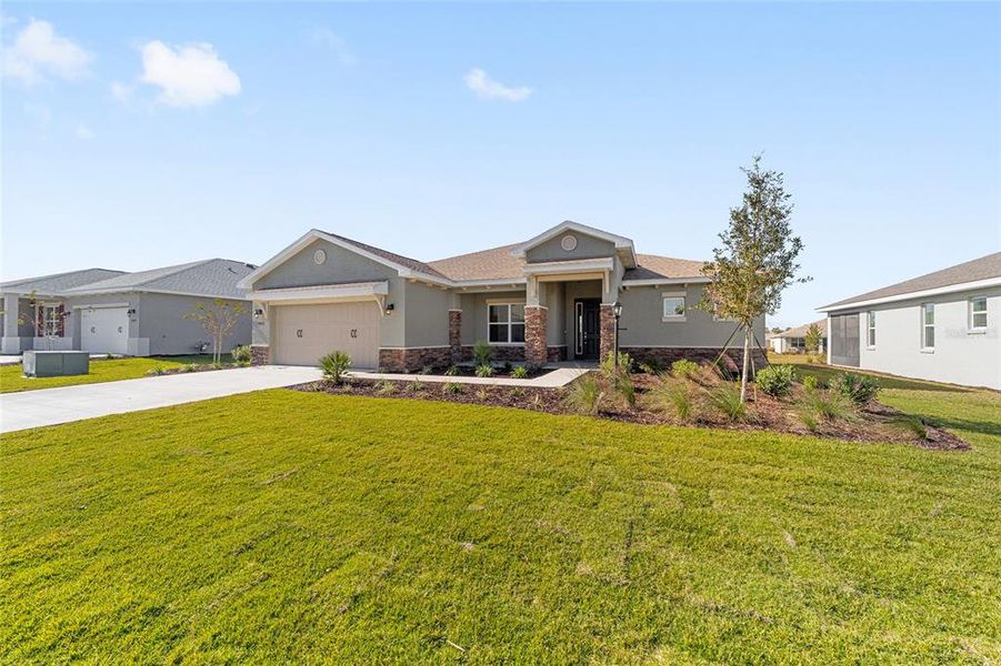 Front exterior of a new home in , Ocala, FL, highlighting curb appeal (Image 20). Front exterior of a new home in , Ocala, FL, highlighting curb appeal (Image 20).