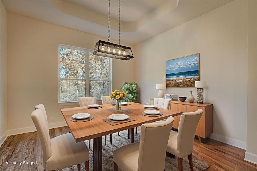 Dining area virtually staged for demonstration purposes.