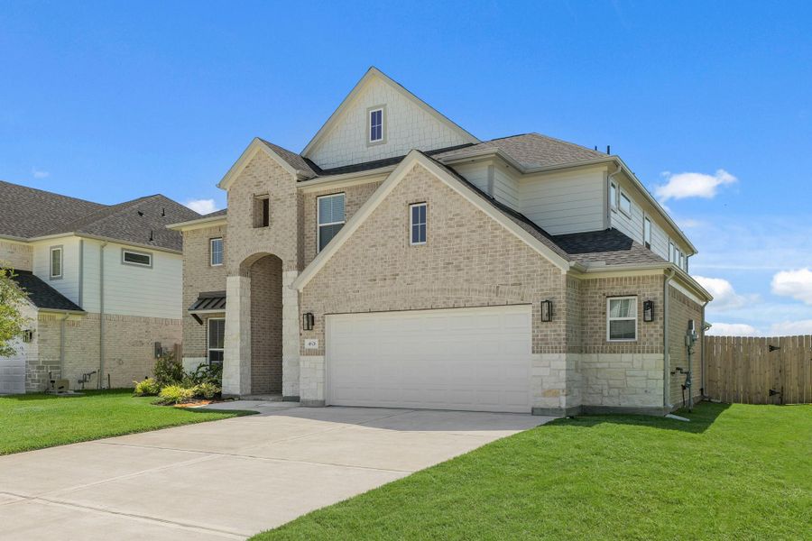 Front exterior of a new home in Briarwood Crossing, Rosenberg, TX, highlighting curb appeal (Image 22).